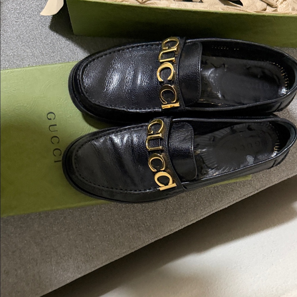 Gucci Black Leather Loafers with Gold Accents